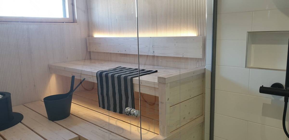 Led pásek osvětlení sauny. Nepřímé světlo směrem nahoru od opěradla a dolů od stropu. Ledstore.fi