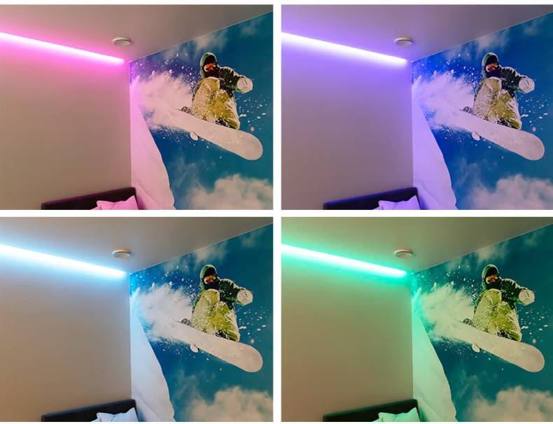 Nástěnná malba s motivem snowboardu oživená LED světly LedStore.fi ve vyměnitelných barvách - růžové, fialové, modré a zelené - vytváří v domě rodiny z Espoo ve městě Kaitamäki působivé a dynamické osvětlení.