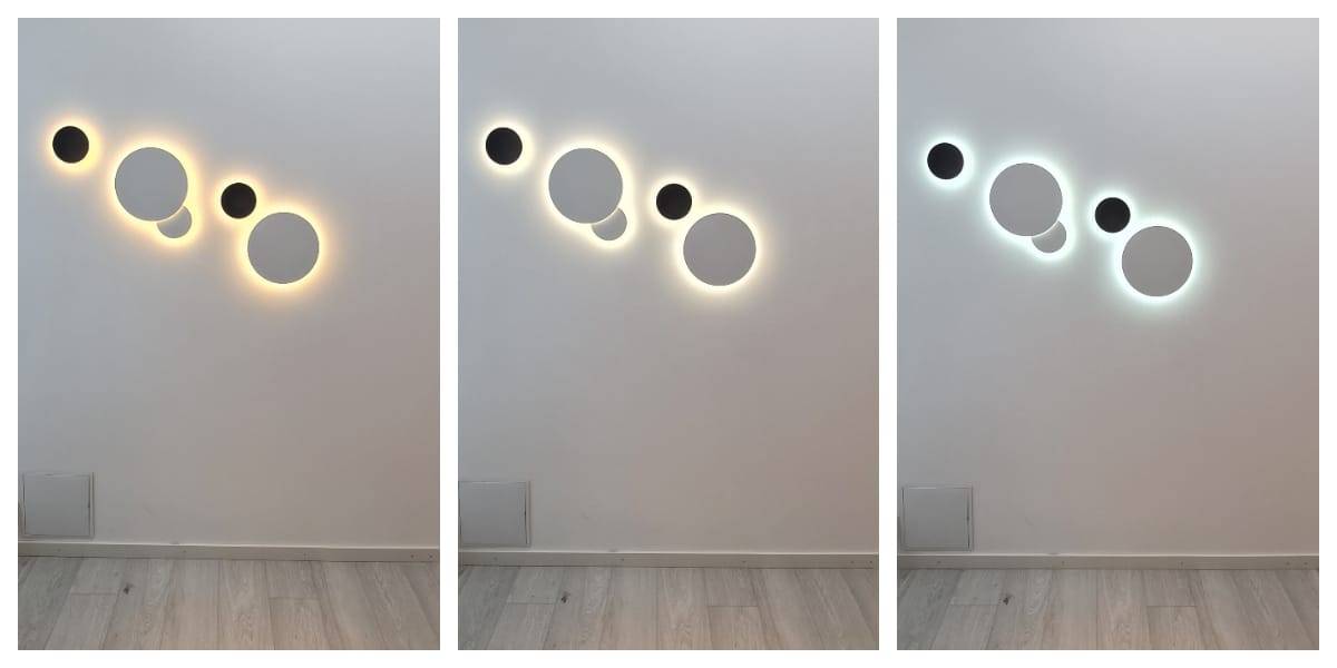 LedS.fi verkkokaupasta löytyy useita sarjan LED-seinävalaisimen muodostaen pyöreitä design-elementtejä eri kokoisina, täydellinenna valkoiseen seinään. Jokainen valaisin luon valaistustunnelman: lämpimän keltaisen, pehmeän valkoisen ja viilemmän sinertävän hehkun. Ympäröivä seinä ja lattia ovat sävyltään harmaita.